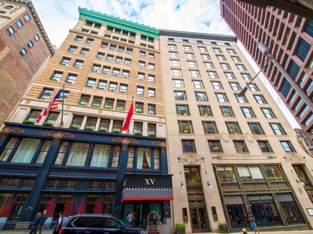 Exterior view of the XV Beacon Hotel and other buildings