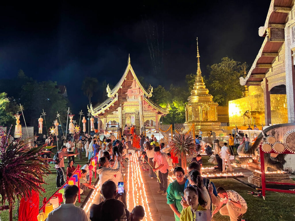 People lighting candles during the Yi Peng festival