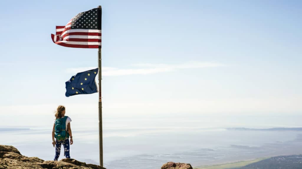 A young girl overlooking the view from Flat Top Mountain