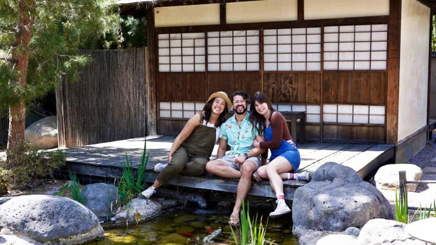 The author Betty Hurd with her friends sitting near the koi pond at the Yume Japanese Gardens of Tucson