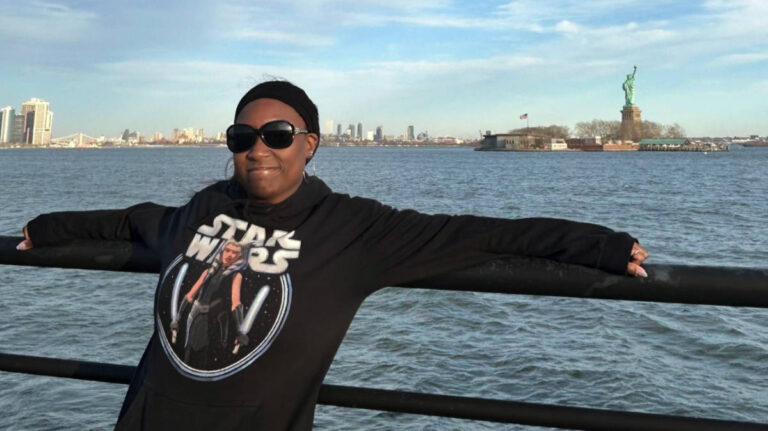 The author Yvette Griffith smiling for a photo at the Liberty State Park