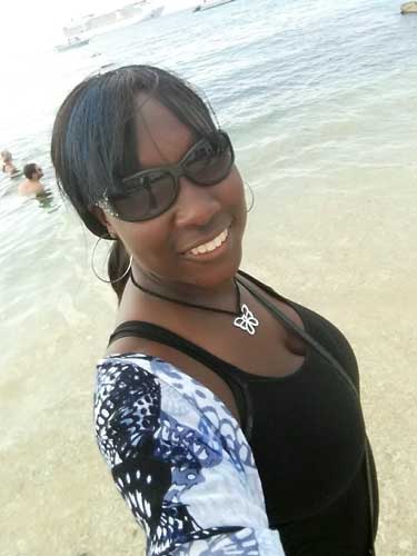 Yvette Griffith smiling for a selfie in Grand Cayman