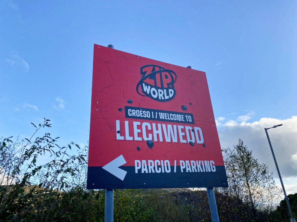 Clear blue sky over the Zip World Llechwedd signage