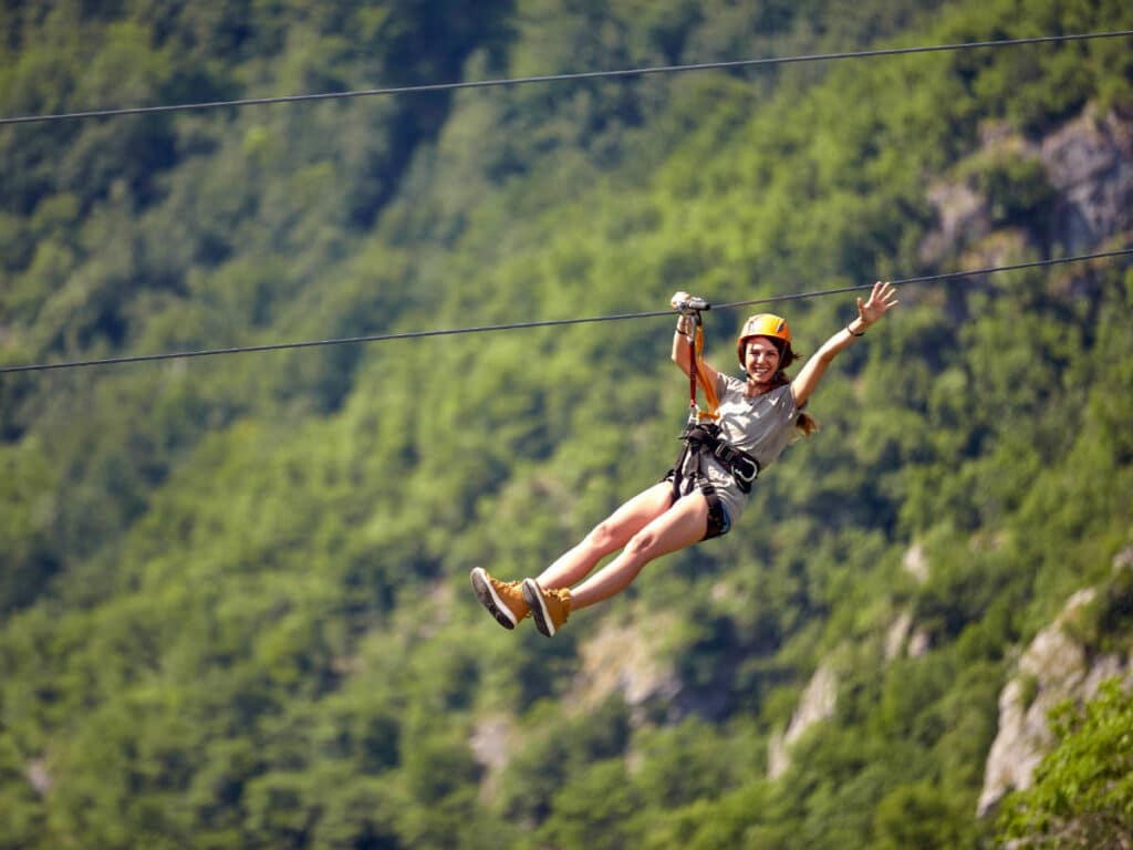 A woman enjoying her zipline ride at Toro Verde Adventure Park