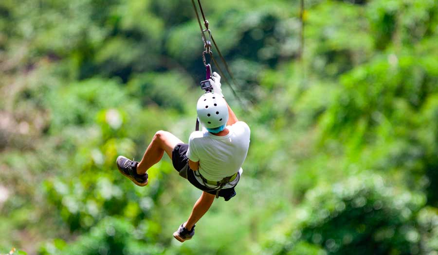 A man enjoying ziplining in St. Thomas