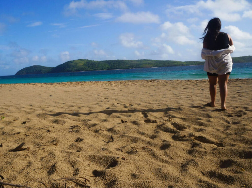 Author Vanessa Ramos standing at Zoni Beach