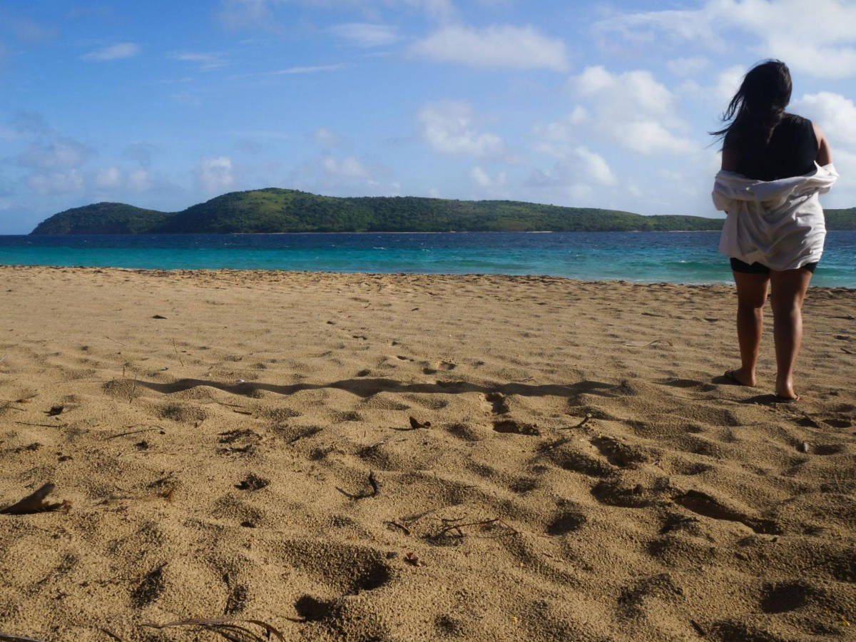 The author Vanessa Ramos admiring the view in Zoni Beach