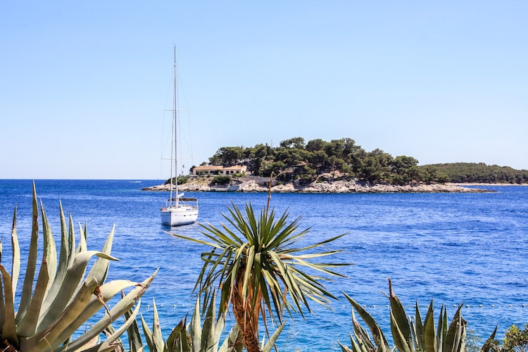 A boat sits in the harbor near Split