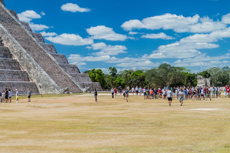 Crowds of tourists visit the Kukulkan pyramid at the archeological site Chichen Itza.