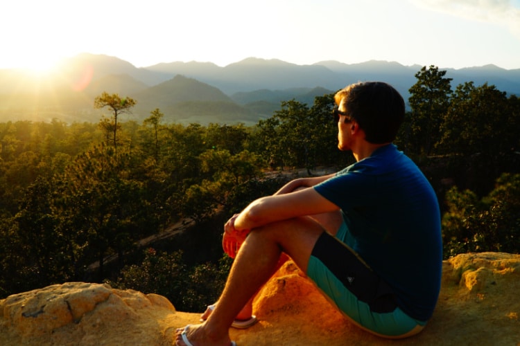 Travel Lemming founder Nate Hake admiring the setting sun at Pai Canyon