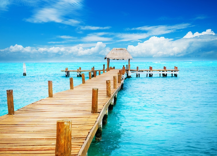 Vacation in Tropic Paradise. Jetty over blue waters in on Isla Mujeres