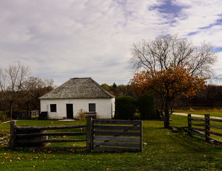 A house surrounded by fencing at the Lower Fort Garry National Historic Site in Manitoba, Canada