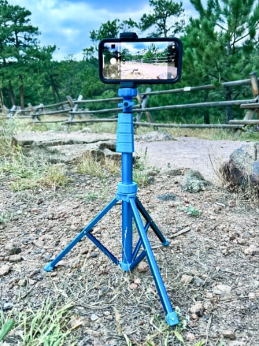 A mobile phone mounted on the minimum height of Sensyne 62'' Phone Tripod & Selfie Stick