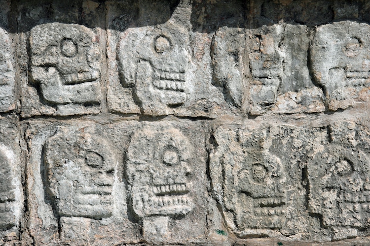 Stone carvings of skulls at Chichen Itza