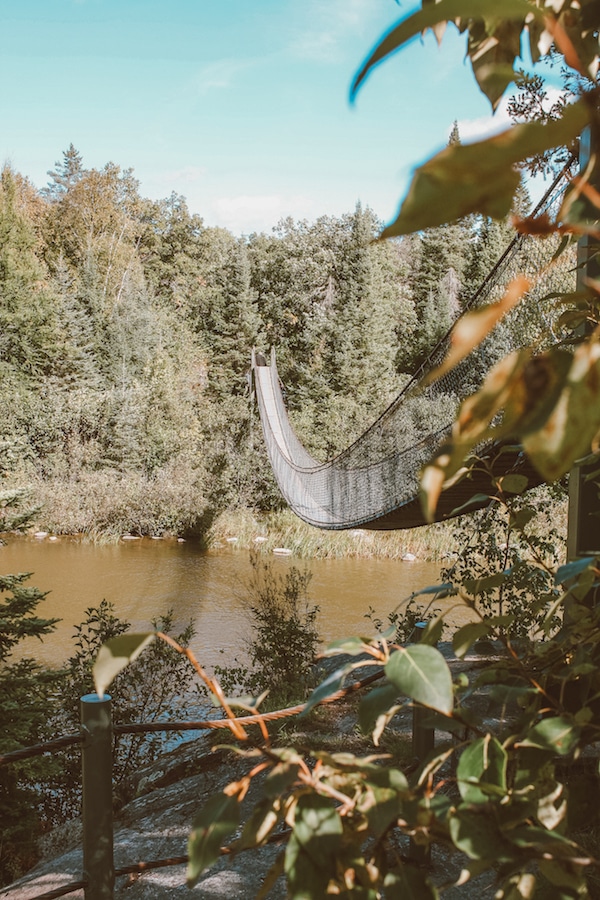 Pinawa Dam suspension bridge in Manitoba, Canada rests above a river