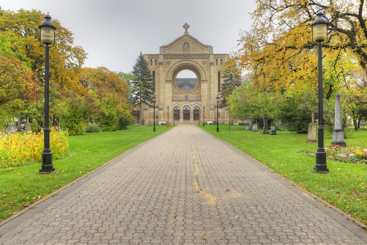 Walkway of a cathedral with lamps