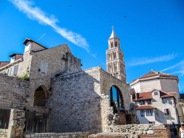 Downtown Split with a view of the bell tower and old brick buildings.