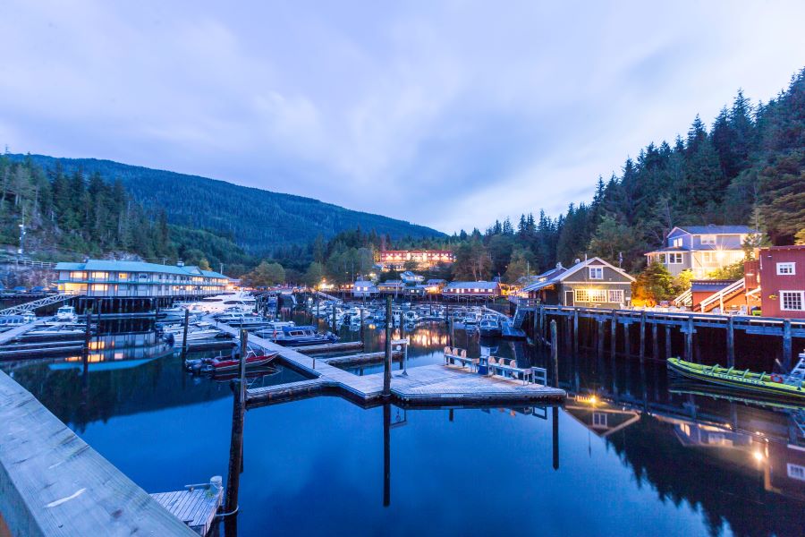 Telegraph Cove in Vancouver Island at blue hour, with a lit-up marina