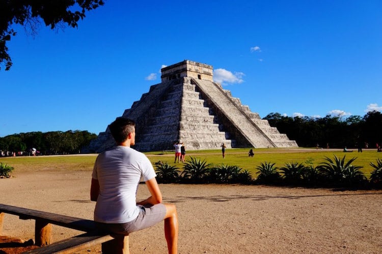 Travel Lemming's founder, Nate Hake sitting in front of a pyramid